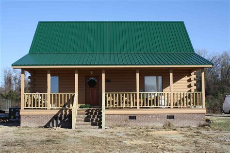 green siding house with metal roof|forest green metal roofing.